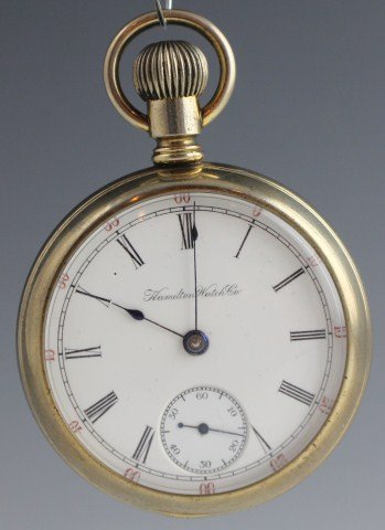 HAMILTON BASE METAL CASE POCKET WATCH DISPLAY BACK: HAMILTON BASE METAL CASE POCKET WATCH DISPLAY BACK Top wind, Size 18, Silver look pocket watch. Open display back. Porcelain dial, black roman numerals and black pointers. Second hand. Movement is num