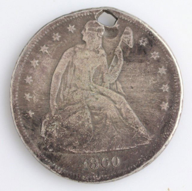 1860 SEATED HALF DOLLAR SOLDIER AND CSA STAMP: 1860 SEATED HALF DOLLAR SOLDIER AND CSA STAMP A seated liberty half dollar coin minted in 1860. Obverse of coin is stamped with the Confederate States of America acronym on the eagle, and the edge is