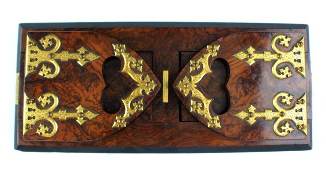 QUALITY BURL WALNUT SLIDING BOOK END STAND: QUALITY BURL WALNUT SLIDING BOOK END STAND A very high quality early 20th century English book stand. Burl walnut with brass fixtures. Distributed by George Shreve Co, San Francisco. Betjemanns patent