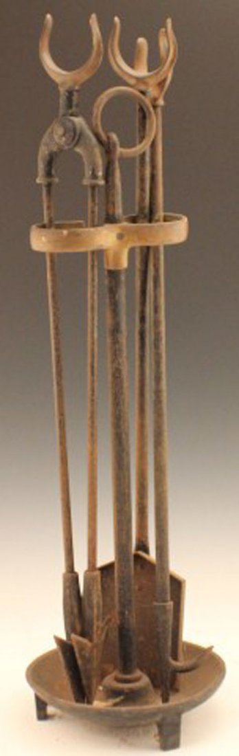 THREE TOOL SET OF CAST IRON FIRE IRONS: THREE TOOL SET OF CAST IRON FIRE IRONS Including the stand. Poker, grips and shovel.