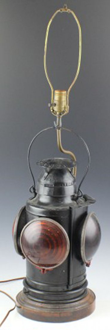 LARGE ST LOUIS MADE RAILROAD LAMP TABLE LIGHT: LARGE ST LOUIS MADE RAILROAD LAMP TABLE LIGHT A New York, New haven & Hartford Railroad lamp made by Handlan, St Louis. Attached to a wood stand with light fitting. Size: 33" total height