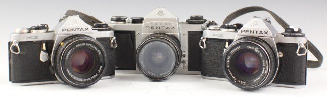 LOT OF 3 ASAHI PENTAX CAMERAS SV AND ME MODELS: LOT OF 3 ASAHI PENTAX CAMERAS SV AND ME MODELS SV with Super-Takumar 1:3.5 5/35mm with neck strap. The other 2 are ME models with SMC pentax-M 1:2 50mm and Super-Takumar 1:1.8/55 lenses.