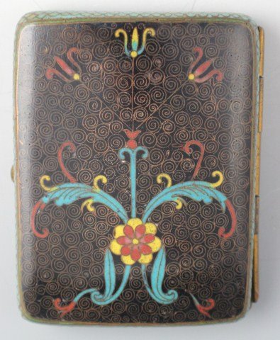 20TH CENTURY CHINESE CLOISONNE CIGARETTE CASE: 20TH CENTURY CHINESE CLOISONNE CIGARETTE CASE Early 20th century brass cigarette case, cloisonne enameld within swirling patterns and stylized floral design to both sides. Size: 3.5" x 2.5"