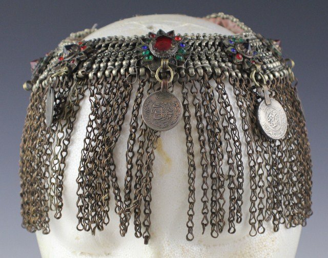 PERSIAN LADIES WEDDING VEIL HEADDRESS: PERSIAN LADIES WEDDING VEIL HEADDRESS Chainmail headdress, worn by the bride at weddings. Adorned with colored glass and silver coins (one absent).