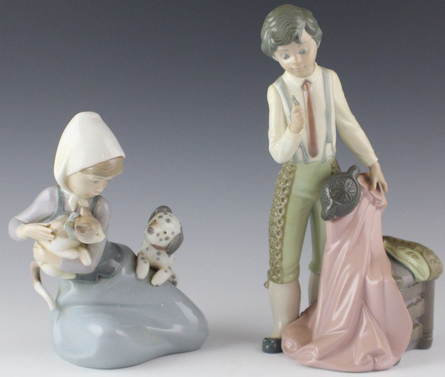 2 LLADRO PORCELAIN FIGURES #5115 & #5032: 2 LLADRO PORCELAIN FIGURES #5115 & #5032 01005115. LITTLE BOY-BULLFIGHTER. Issue Year: 1982. Retirement Year: 1985. Sculptor: José Roig. 01005032. DOG AND CAT. Issue Year: 1979. Retirement Year: 1998