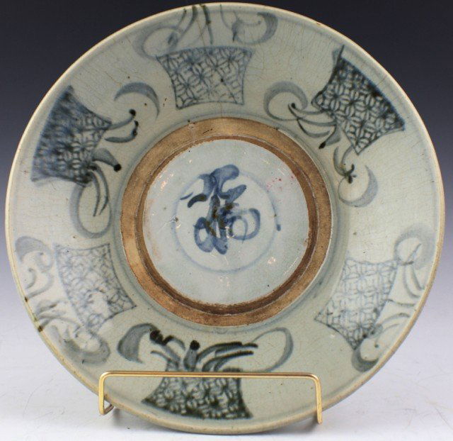 19TH CENTURY CHINESE EARTHENWARE GLAZE BOWL: 19TH CENTURY CHINESE EARTHENWARE GLAZE BOWL Chinese made earthenware bowl with an applied glaze. Calligraphy brushwork surrounds a wax resist circle, within which is a Chinese character. A wax seal is