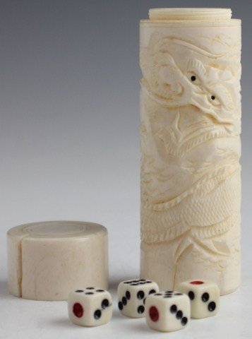 BONE CYLINDER DICE CUP AND HOLDER: BONE CYLINDER DICE CUP AND HOLDER Small cylinder bone dice cup with 4 small six sided die. Top screws on but has a large crack stopping it from sealing at the top. , Size: 3.5", Est. 50-150, Lot 30371