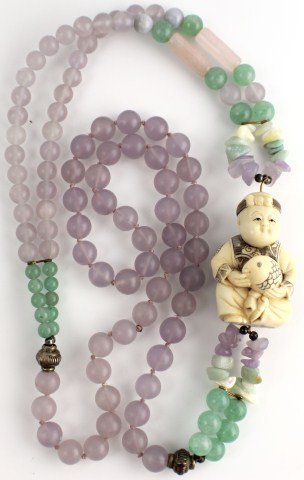 ICY LAVENDER & JADE NECKLACE WITH IVORY FISHERMAN: ICY LAVENDER & JADE NECKLACE WITH IVORY FISHERMAN Icy lavender beads ranging; 47 beads 9.5mm and 36 beads 8mm. Green jade beads ranging 10 beads 5.75mm and 12 beads 8.8mm. 1.8" Ivory carved netsuke fi