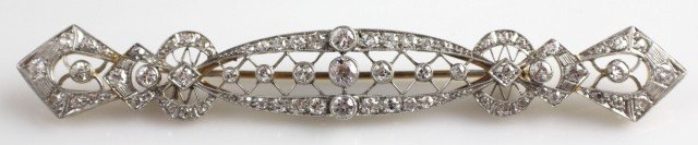 ANTIQUE 14K GOLD & PLATINUM DIAMOND BROOCH: ANTIQUE 14K GOLD & PLATINUM DIAMOND BROOCH A 14K yellow gold and platinum brooch studded with diamonds. 3 Old European cut diamonds weighing 0.18 to 0.25 ct each, SI-2 to I-1 clarity, and I-J color. 6