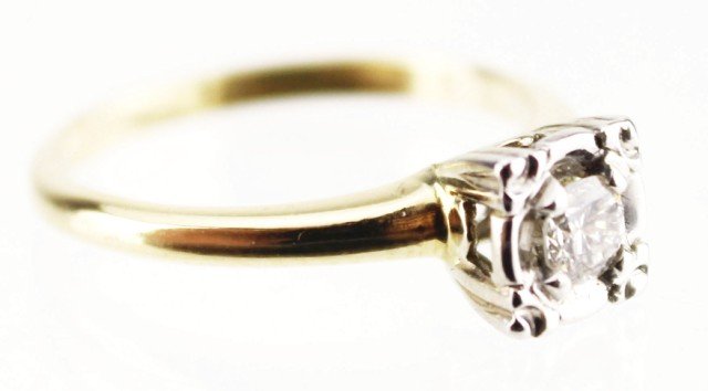 LADIES 14K GOLD DIAMOND SOLITAIRE ENGAGEMENT RING: LADIES 14K GOLD DIAMOND SOLITAIRE ENGAGEMENT RING Ladies vintage style engagement ring featuring a 0.18 ct round cut diamond, bead set in a 14K white gold square setting. 14K yellow gold band. Weight: