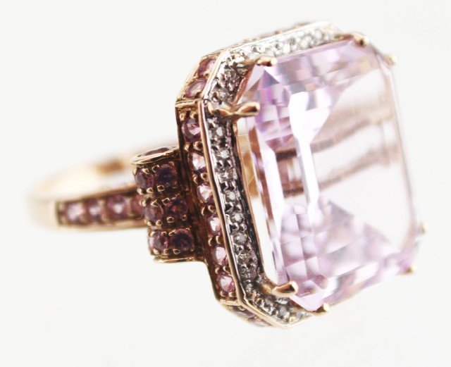 LADIES 14K GOLD MORGANITE AND DIAMOND RING: LADIES 14K GOLD MORGANITE AND DIAMOND RING Large emerald cut morganite in raised cathedral setting with accent diamonds and morganites. Set in 14K gold. Weight: 10g, Size: 8, Est. 500-1000, Lot 30646