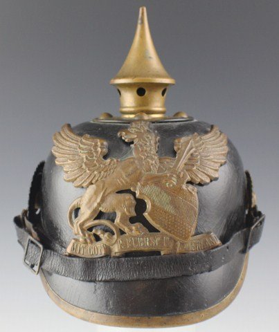 PRUSSIAN M1895 BADEN PICKELHAUBE: PRUSSIAN M1895 BADEN PICKELHAUBE A model 1895 Pickelhaube with a brass Baden Train Battalion frontplate. The brass topspike is mounted onto the leather via four posts. A sliding vent is fixed to the b