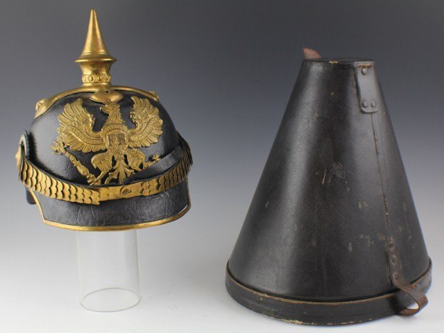 PRUSSIAN OFFICER LINE PICKELHAUBE AND CASE: PRUSSIAN OFFICER LINE PICKELHAUBE AND CASE A Prussian Line Officer's Pickelhaube. Prussian coat of arms front plate, officer's cruciform spike base with stars to left and right posts and officer patte
