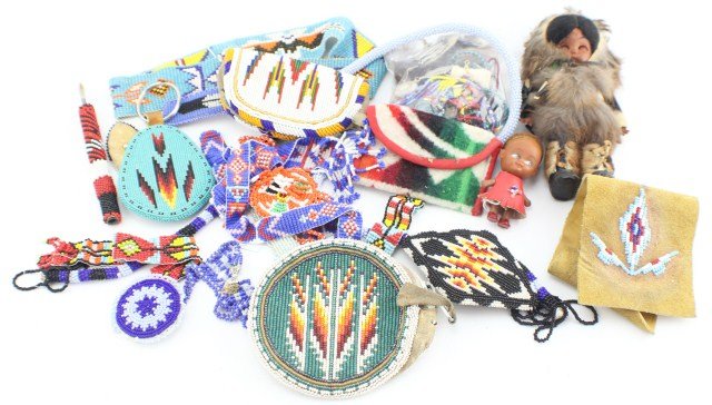 VINTAGE NATIVE AMERICAN JEWELRY AND ACCESSORIES: VINTAGE NATIVE AMERICAN JEWELRY AND ACCESSORIES One keychain, three coin purses, two bracelets, three necklaces, three barrettes, one belt buckle, one pen cover, a belt, headband, assortment of dreamc