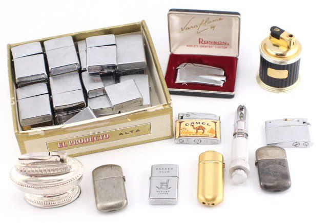 LOT OF LIGHTERS ZIPPO RONSON AND MORE: LOT OF LIGHTERS ZIPPO RONSON AND MORE 9 zippo lighters with cases; 18 zippo lighter cases; two vintage Ronson lighters with boxes; seven various other lighters; and a cigar drill. All need fluid. Weig