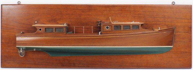 EARLY 20TH C. SHIP BUILDERS HALFBOAT MODEL OF YACHT: EARLY 20TH C. SHIP BUILDERS HALFBOAT MODEL OF YACHT This is the ship builders half boat model of the "WASP", a motorized yacht that once sailed the US Great Lakes. Boat hull made out of a single solid