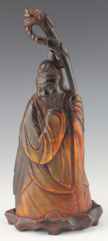 EARLY 20TH CENTURY CHINESE CARVED HORN FIGURE: EARLY 20TH CENTURY CHINESE CARVED HORN FIGURE Chinese carved deity figure of Lohan. Finely carved from buffalo horn. Size: 7.5" with stand., Est. 100-200, Lot: 32159