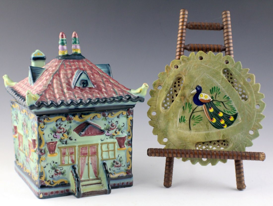 JADE DECORATIVE MEDALLION AND LIDDED PORCELAIN BOX: JADE DECORATIVE MEDALLION AND LIDDED PORCELAIN BOX Round carved jade 6" medallion with peacock painted on, with stand. Hand painted ceramic lidded box in the shape of a house, 5" square by 9" tall. Ma