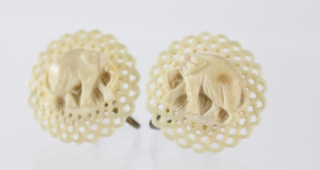 Carved and shaped antique ivory earrings  price guide and values