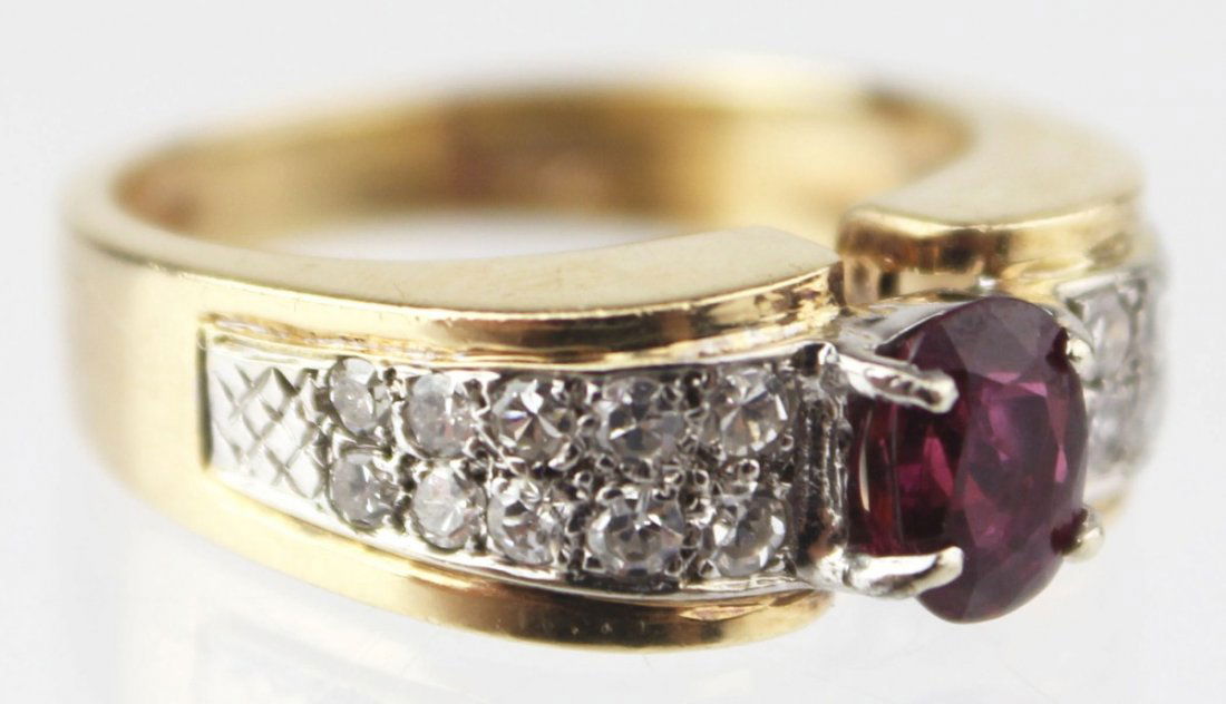 LADIES 14K RED SPINEL AND DIAMOND RING: LADIES 14K RED SPINEL AND DIAMOND RING Ladies 14K yellow gold ring with center oval ruby (4 x 6mm) with 20 round diamond accents, approximately 0.01 cts each. Marked 14K Size: 6.25, Weight: 5.8g, Est.