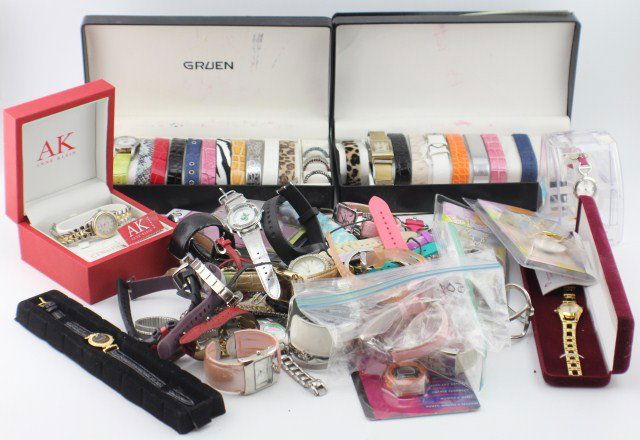LOT OF 50+ WOMENS QUARTZ WRIST WATCHES: LOT OF 50+ WOMENS QUARTZ WRIST WATCHES A grouping of 15 women's wrist watches. Including Fossil, Anne Klein, Timex, Bradley, and more. Plus 2 boxes of Gruen and Gossip watches with bezel and watch ban