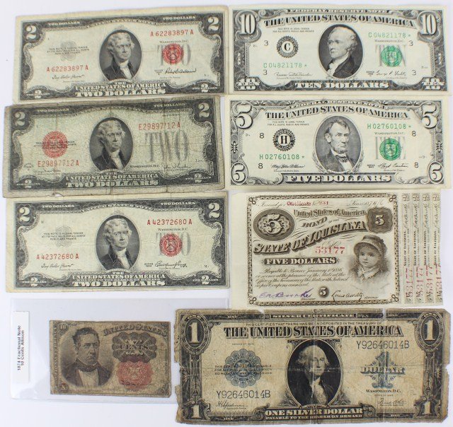 US CURRENCY SILVER CERT FRACTIONAL RED & BLUE SEAL: MIXED LOT OF US CURRENCY One large blue seal silver certificate 1923; five dollar bearer bond from the State of Louisiana 1874; 1874 fractional note, 10 cents; three red seal two dollar bills; also in
