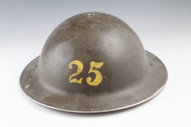 US ARMY HOME SERVICES MILITARY HELMET - WWII 1941: US ARMY HOME SERVICES MILITARY HELMET - WWII 1941 WWII helmet in field green. Painted 25 to the front and rear. Shell is stamped CL0 1941. Liner. Chin strap is absent. Size: N/A, Est. 50-100, Lot: 324