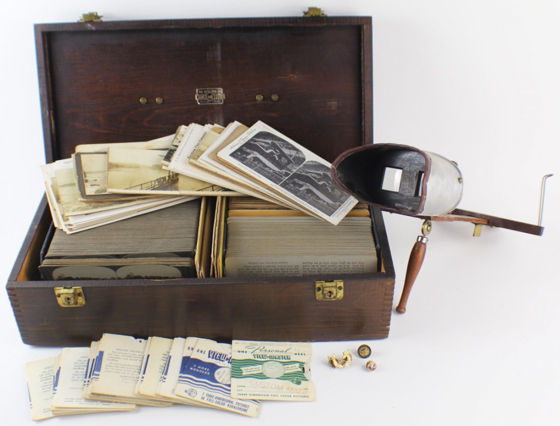 STEREOVIEWER AND 100+ VIEWING CARDS: STEREOVIEWER AND 100+ VIEWING CARDS A stereoviewer and over 100 viewing cards in carrying case. The viewer is of wood and metal construction, with folding handle and sliding card holder. The cards fea