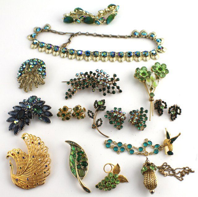 VINTAGE GREEN COSTUME JEWELRY 16 PIECES: VINTAGE GREEN COSTUME JEWELRY 16 PIECES 9 pins, one "Coro", one marked "LC"; two bracelets, one with swan, one marked "B.S.S"; one "Coro" bracelet; three pairs earrings, one marked "Star". Weight: 0.6