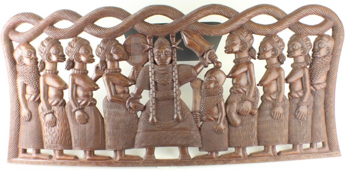 LARGE AFRICAN WOODEN CARVED PLAQUE: LARGE AFRICAN WOODEN CARVED PLAQUE Large African Wooden Carving depicting a Warrior Chief Surrounded by his tribe. Has minor crack in left center edge. Size: 38.5 x 18" Est. $ 100-300 Lot 31119