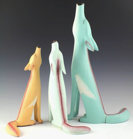 LOT OF 3 WOODEN CARVED HOWLING COYOTES: LOT OF 3 WOODEN CARVED HOWLING COYOTES Lot of 3 Wooden Carved Coyotes Howling. Wood is painted in vibrant colors of blue, orange and red and are absent of any makers or artist marks. Est. $ 50-100 Lot