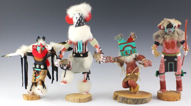 FOUR SIGNED HOPI KACHINA DANCING DOLLS: FOUR SIGNED HOPI KACHINA DANCING DOLLS Lot of four Hopi Kachina dancing figures to include: Yo-we, Corn Dancer, War Clown Dancer, and Eagle Dancer. All are signed and titled to the base. Size: 8 1/4 -