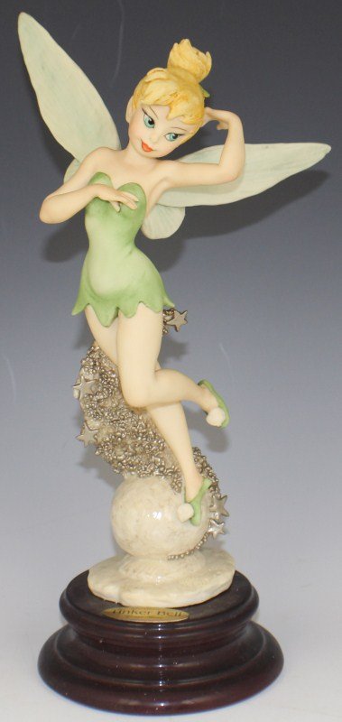 ARMANI PORCELAIN TINKER BELL - WALT DISNEY 209C: ARMANI PORCELAIN TINKER BELL - WALT DISNEY 209C Walt Disney's "Tinker Bell" by Giuseppe Armani. Porcelain figurine on wooden base. Made in Italy. Size: 12" (with base) Est. $ 200-400 Lot 31202