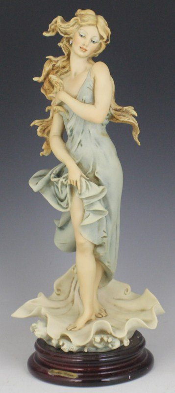 ARMANI CAPODIMONTE PORCELAIN FIGURE VENUS 881C: ARMANI CAPODIMONTE PORCELAIN FIGURE VENUS 881C Porcelain figurine on wooden base, Venus, by Giuseppe Armani. Marked with Capidimonte "N" Crown Pottery Mark, hand signed. 1993 Armani Collector's Societ