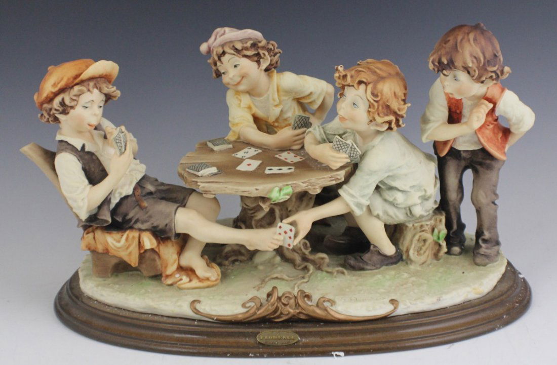 ARMANI CAPODIMONTE PORCELAIN THE CHEATS 280C: ARMANI CAPODIMONTE PORCELAIN THE CHEATS 280C Guiseppe Armani Capodimonte porcelain figure, The Cheats. Marked with Capodimonte "N" Crown Pottery Mark. Made in Italy. No foam in top of box. Size: 13" (