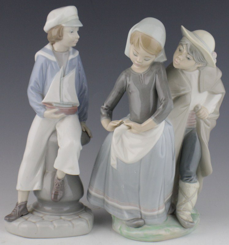 BOY WITH YACHT & LITTLE COUPLE KISSING LLADRO: BOY WITH YACHT & LITTLE COUPLE KISSING LLADRO Lot of two retired Lladro figurines. Boy with Yacht, 4810, Issue Year: 1991, Retirement Year: 1996, Sculptor: José Puche, Size: 10". Little Couple Kissin