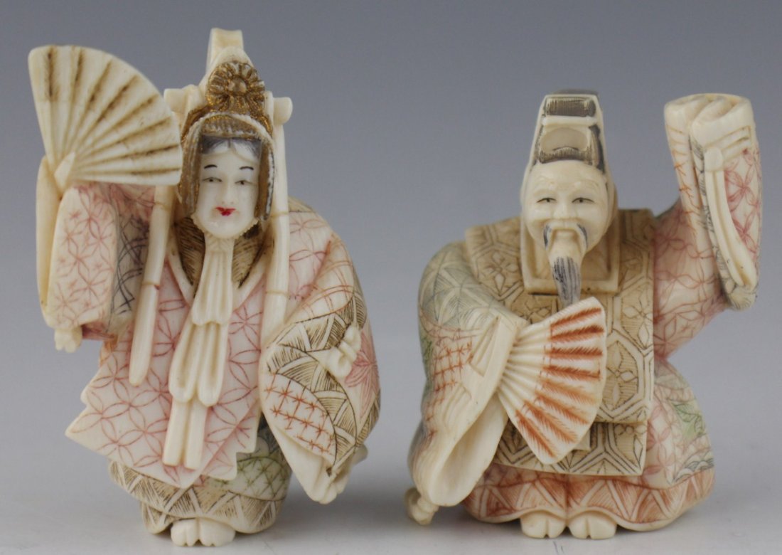 CHINESE IVORY POLYCHROME EMPEROR/EMPRESS NETSUKE: CHINESE IVORY POLYCHROME EMPEROR/EMPRESS NETSUKE Chinese carved ivory polychrome netsuke figures in the form of an Emperor and an Empress. Size: 2.5" Est. $ 75-150 Lot 31372