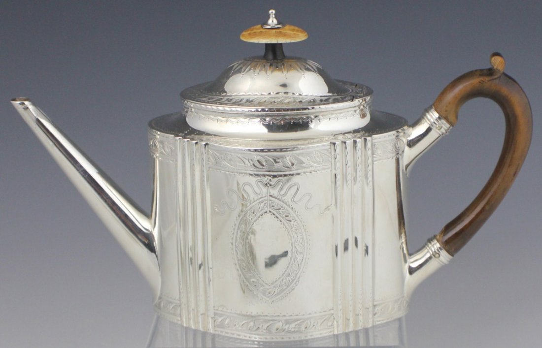 GEORGE III BRIGHT CUT STERLING SILVER TEAPOT 1788: GEORGE III BRIGHT CUT STERLING SILVER TEAPOT 1788 Hand chased, George III sterling silver teapot, of oval form with bright cut decoration, maker Robert Hennell. London hallmark for 1788, 420g total we