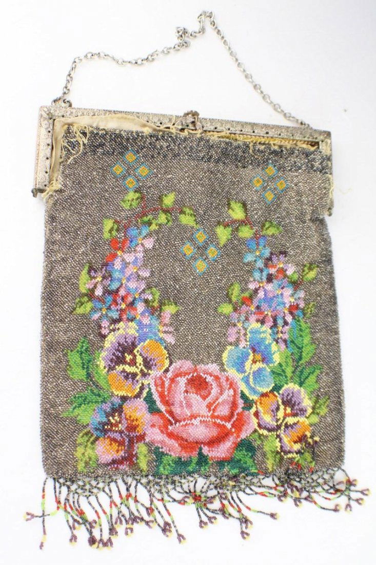VINTAGE MICRO-BEADED FLORAL PURSE: VINTAGE MICRO-BEADED FLORAL PURSE Art deco micro-beaded purse with floral design. Metallic and various colored beads. Lining and beads have mostly detached from frame, lining is otherwise in tact. Min