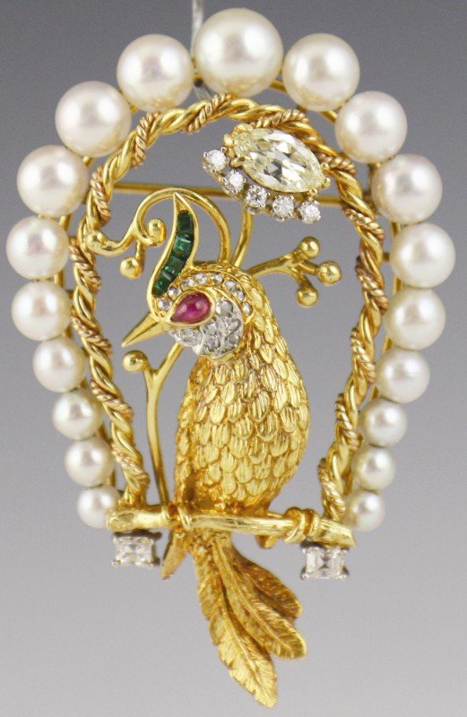 CUSTOM 18K GOLD & DIAMOND & PEARL BIRD BROOCH PIN: CUSTOM 18K GOLD & DIAMOND & PEARL BIRD BROOCH PIN A beautiful 18K yellow gold and diamond estate brooch. Features a bird on a perch with a cabochon ruby eye, 4 small green colored garnet/glass doublet
