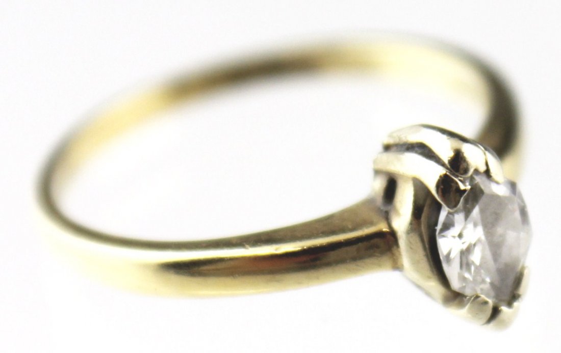 MARQUISE CUT DIAMOND SOLITAIRE ENGAGEMENT RING 14K: MARQUISE CUT DIAMOND SOLITAIRE ENGAGEMENT RING 14K Approximately a 0.3 ct marquise cut diamond set in 14K yellow gold. Weight: 2.1g Size: 6 Est. $ 100-200 Lot 31483