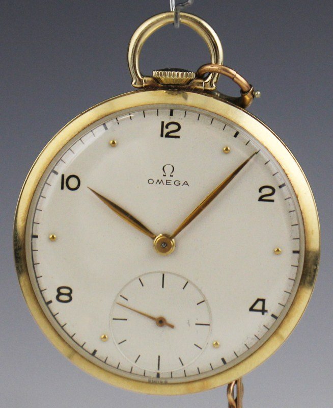 1945 14K OMEGA OPEN FACE POCKET WATCH 17 JEWEL: 1945 14K OMEGA OPEN FACE POCKET WATCH 17 JEWEL 14k yellow gold Omega pocket watch, Gold hands and Arabic even numbers with gold dots used for odd markers, separate sunken gold second hand. Unadjusted 