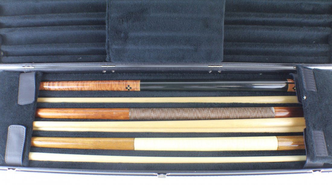 3 POOL CUES IN LEATHER CASE COBRA & 1 MEUCCI SHAFT: 3 POOL CUES IN LEATHER CASE COBRA & 1 MEUCCI SHAFT Three cues and 1 extra Meucci red dot shaft. One of the cues is a Cobra the other two have no names or markings. Cues are in a 6 holder black hard ca