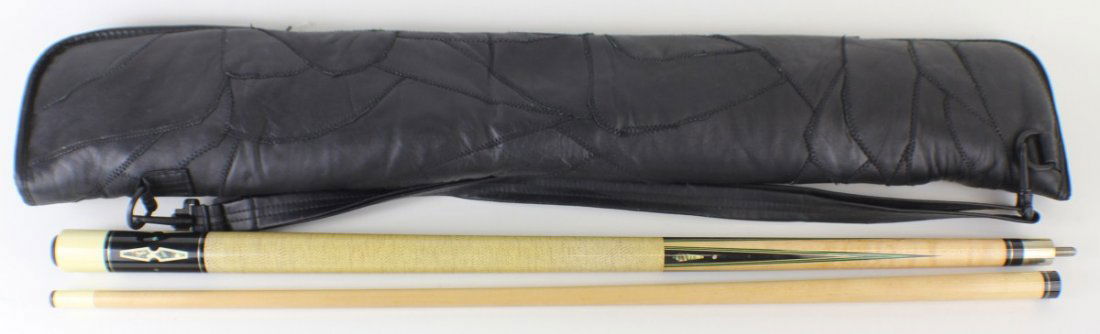 MEUCCI POOL CUE WITH CASE: MEUCCI POOL CUE WITH CASE Meucci two piece cue and with green opal and wood inlay. Comes in black cloth case. Size: 58" Est. $ 100-200 Lot 31676