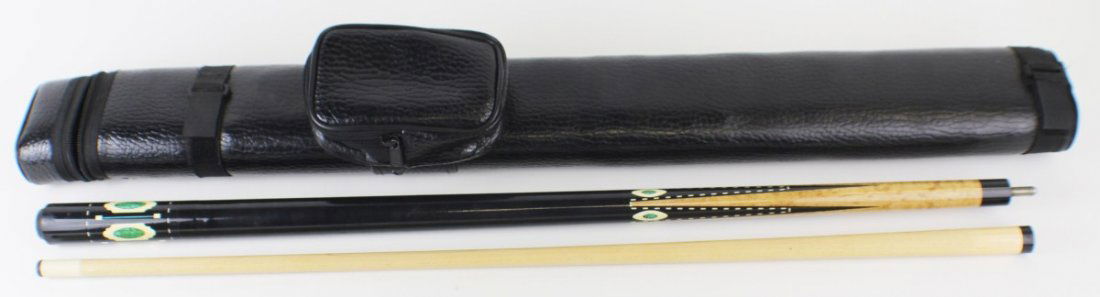 SPECIAL EDITION 6 MEUCCI POOL CUE IN LEATHER CASE: SPECIAL EDITION 6 MEUCCI POOL CUE IN LEATHER CASE Meucci special edition VI #177 two piece black pool cue, crushed turquoise shell with wood inlay in a black leather case. Size: 58" Est. $ 200-400 Lot