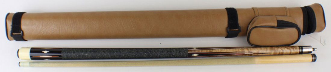 SCHON POOL CUE IN LEATHER CASE: SCHON POOL CUE IN LEATHER CASE Schon two piece pool cue with wood inlay and linen wrap in a tan leather case. Size: 58" Est. $ 200-400 Lot 31681