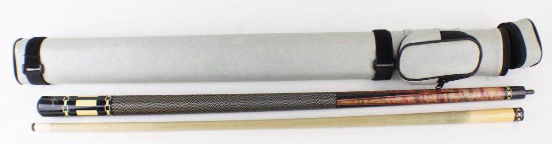MEUCCI POOL CUE IN LEATHER CASE: MEUCCI POOL CUE IN LEATHER CASE Meucci brown and black two piece pool cue with wood inlay and Irish linen wrap in a gray leather case. Size: 58" Est. $ 75-150 Lot 31683