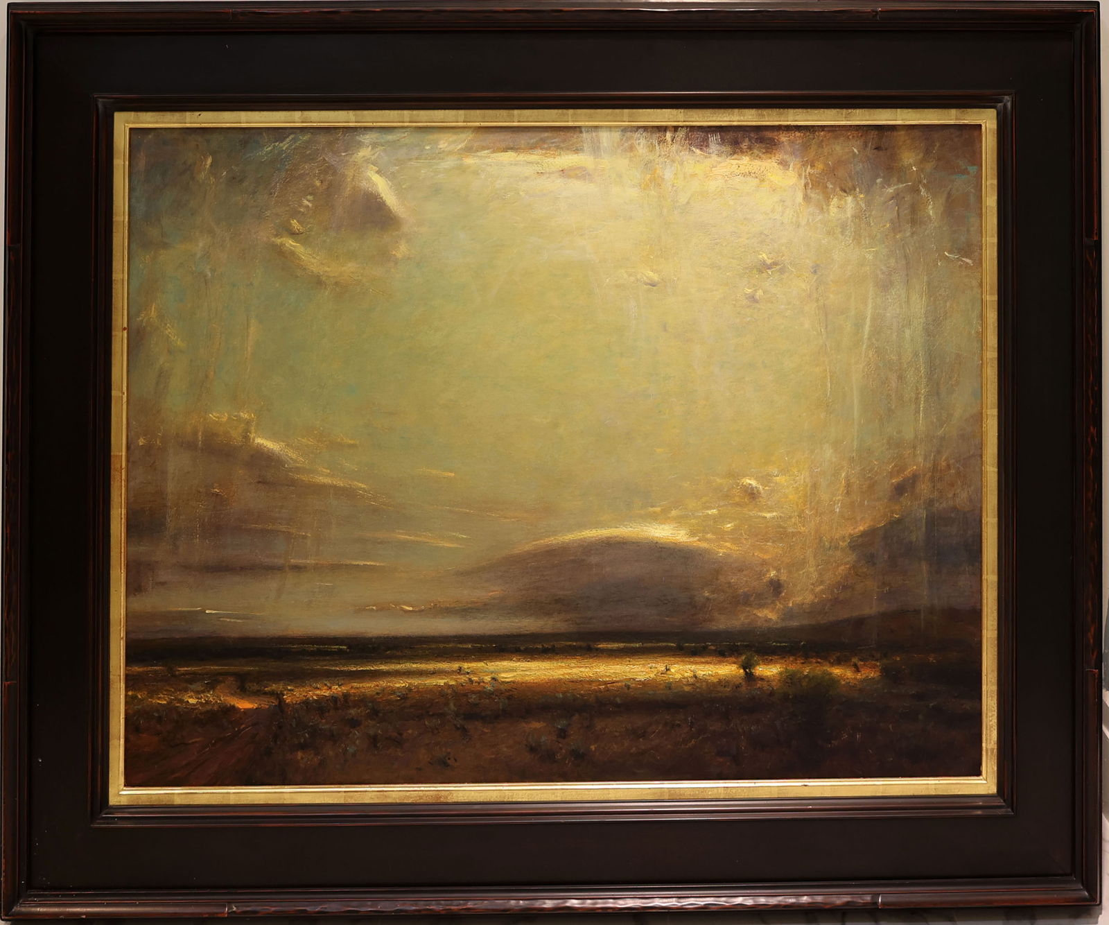 GORDON BROWN SUNLIGHT SHINING THROUGH CLOUDS: Brown, Gordon ( American, B. 1962) Painting. Oil on Masonite - signed lower right. Executed in brush. Gordon Brown never tires of the view from his converted barn/studio on the state's western slope,