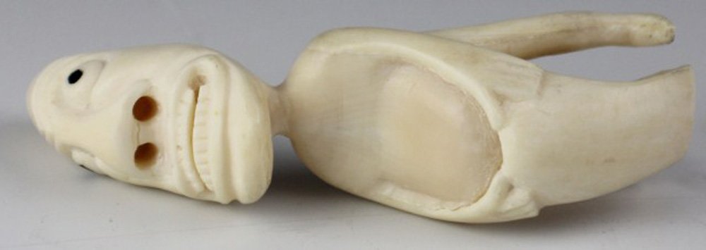 GREENLAND INUIT TUPILAK IVORY SPIRIT FIGURE: GREENLAND INUIT TUPILAK IVORY SPIRIT FIGURE An ivory native Inuit Tupilak spirit figure carved from whale's tooth. Size: 3.25" Est. $100-200 Lot: 33074