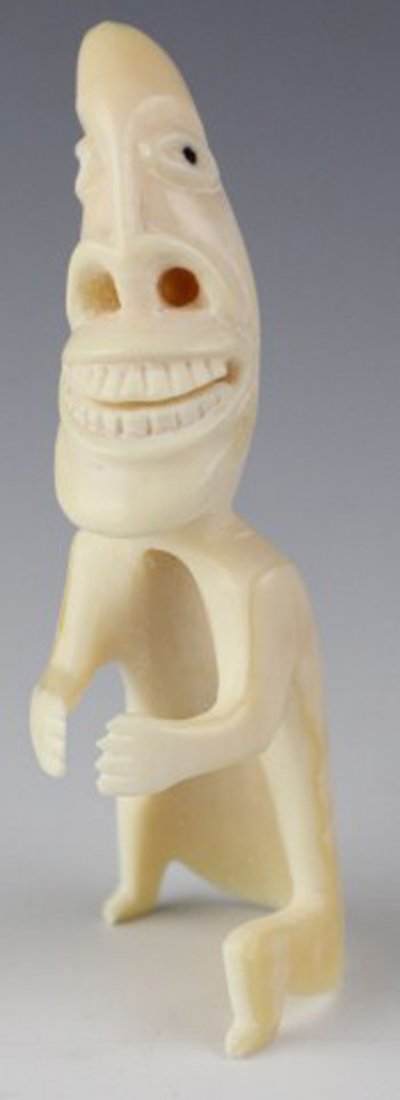 GREENLAND CARVED IVORY TUPILAK FIGURE: GREENLAND CARVED IVORY TUPILAK FIGURE Inuit Tupilak spirit figure carved from whale's tooth. Size: 3.5" Est. $100-200 Lot: 33075